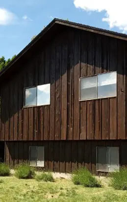 Residential wood siding finished with dark exterior stain in Hermiston, Oregon